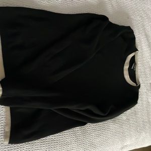 Cashmere sweater with white trim around the collar